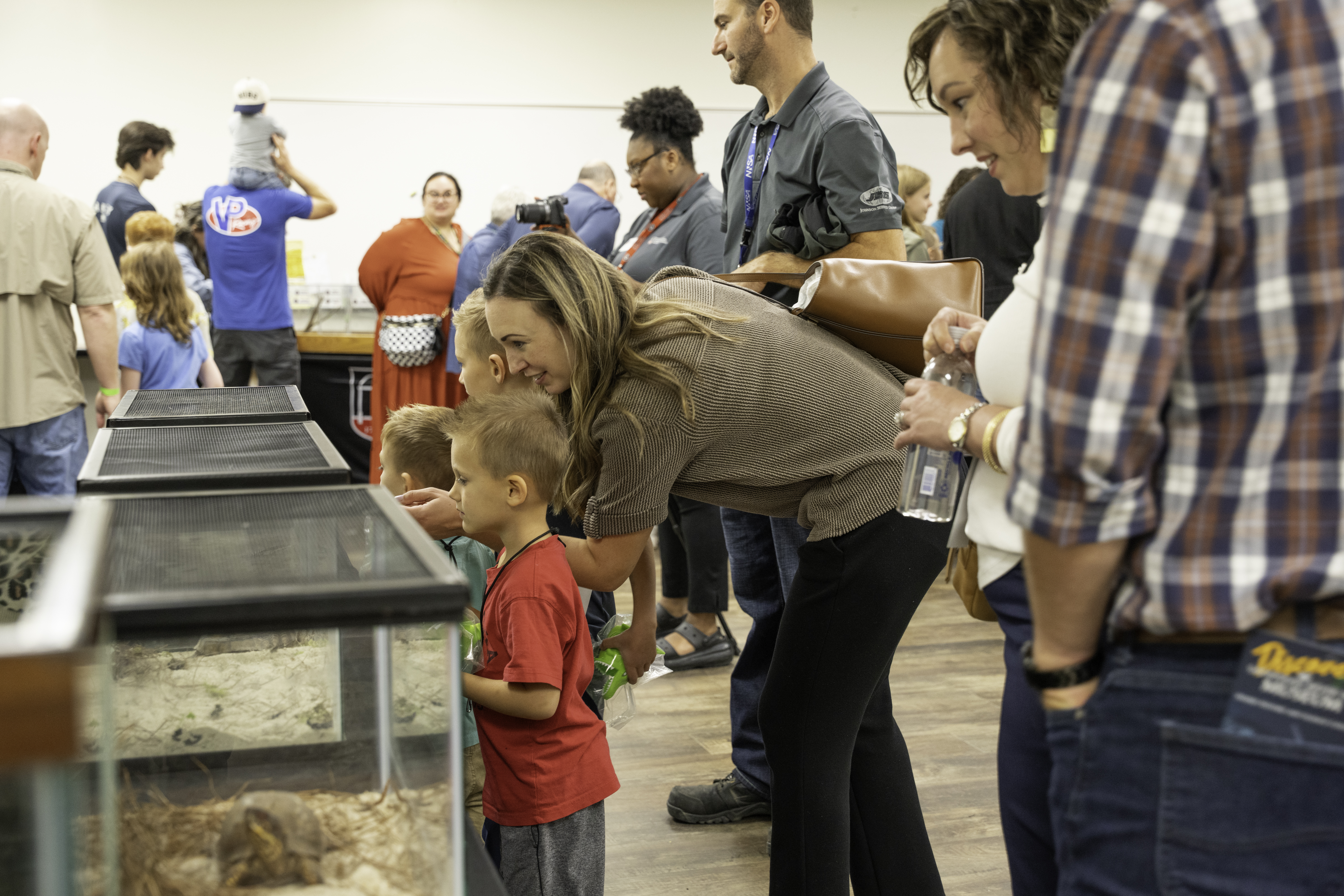SRS employees and their families learn about the Savannah River Ecology Laboratory animals during their showcase.